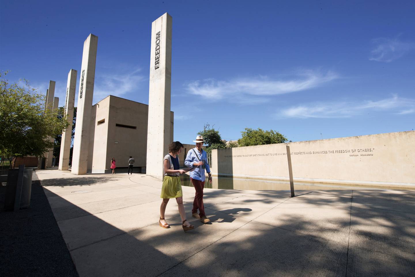 apartheid museum exterior, two people walking